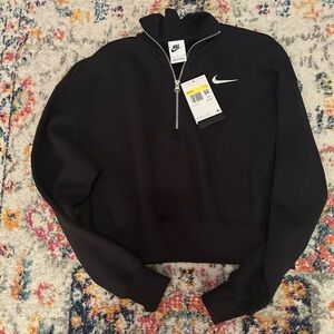 Nike Women’s black half zip in S